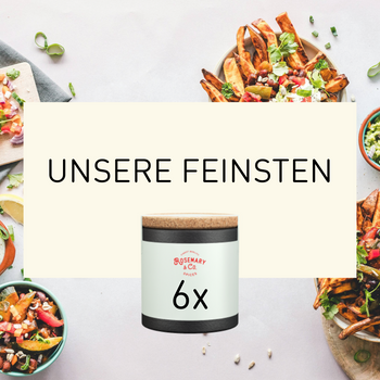 Dose mit Aufschrift Feinsten by Rosemary & Co Gewürze auf cremefarbenem Banner, umgeben von Lebensmitteln