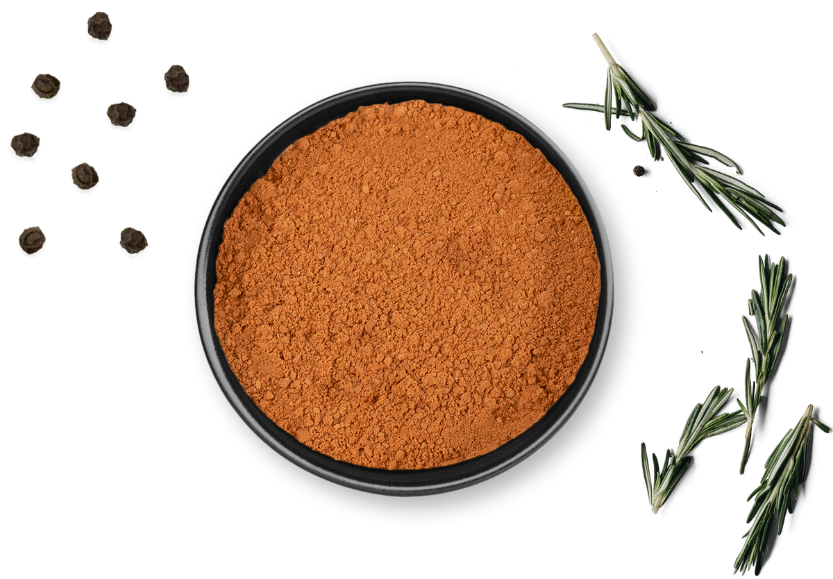 Dose CHOCO MANIA von Rosemary & Co, daneben schwarze Pfefferkörner, Rosmarinzweige, Knoblauchzehe